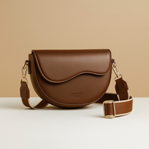 Vintage saddle crossbody bag for women with classic flap closure, adjustable strap, and organised compartments for daily use.