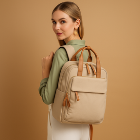 Water-repellent laptop backpack for women with padded 14-inch laptop sleeve, travel trolley sleeve, and stylish lightweight design.