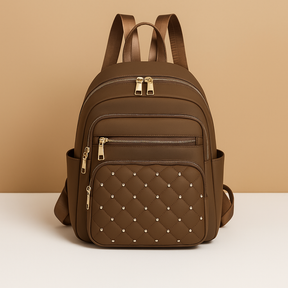 Water-resistant women’s backpack with anti-theft back pocket, adjustable straps, and spacious compartments, perfect for travel or everyday use.