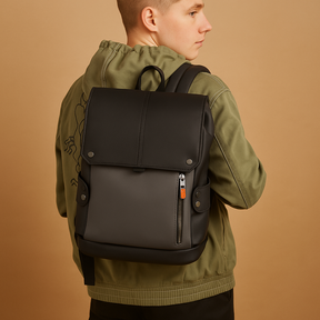 Waterproof leather laptop backpack for men with 15.6-inch laptop sleeve, headphone port, and charging pocket, perfect for work or travel.